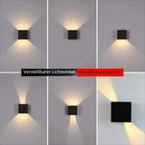 Schwarze Up-&-Down-LED-Außenwandleuchte an einer Hausfassade
