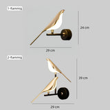Goldene und silberne Varianten der Vogel-Wandleuchte