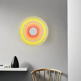 Moderne LED-Wandleuchte in Blumenform – rund & flach, aus Metall